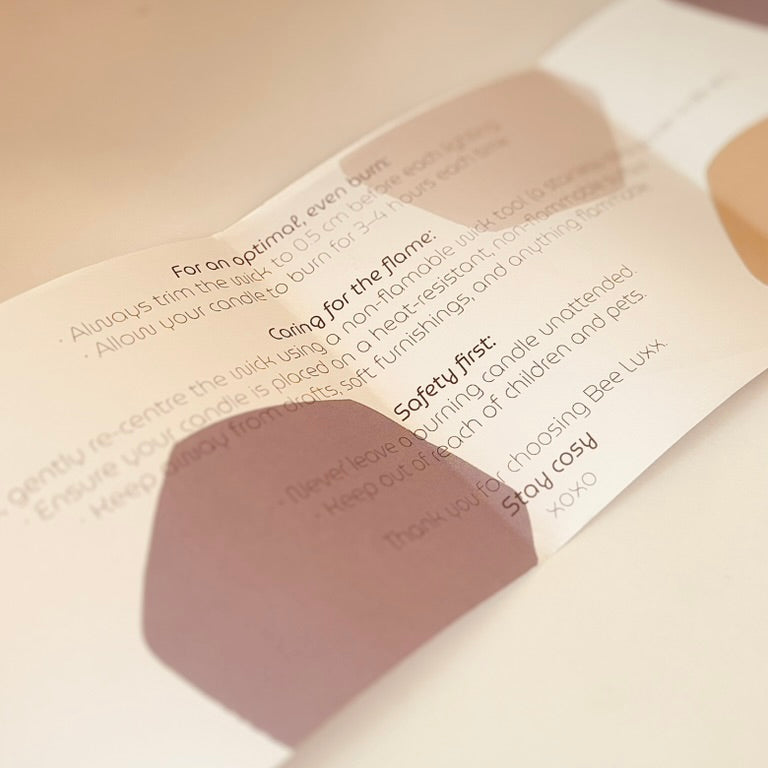 Close-up of a product packaging with use instructions on a white surface.